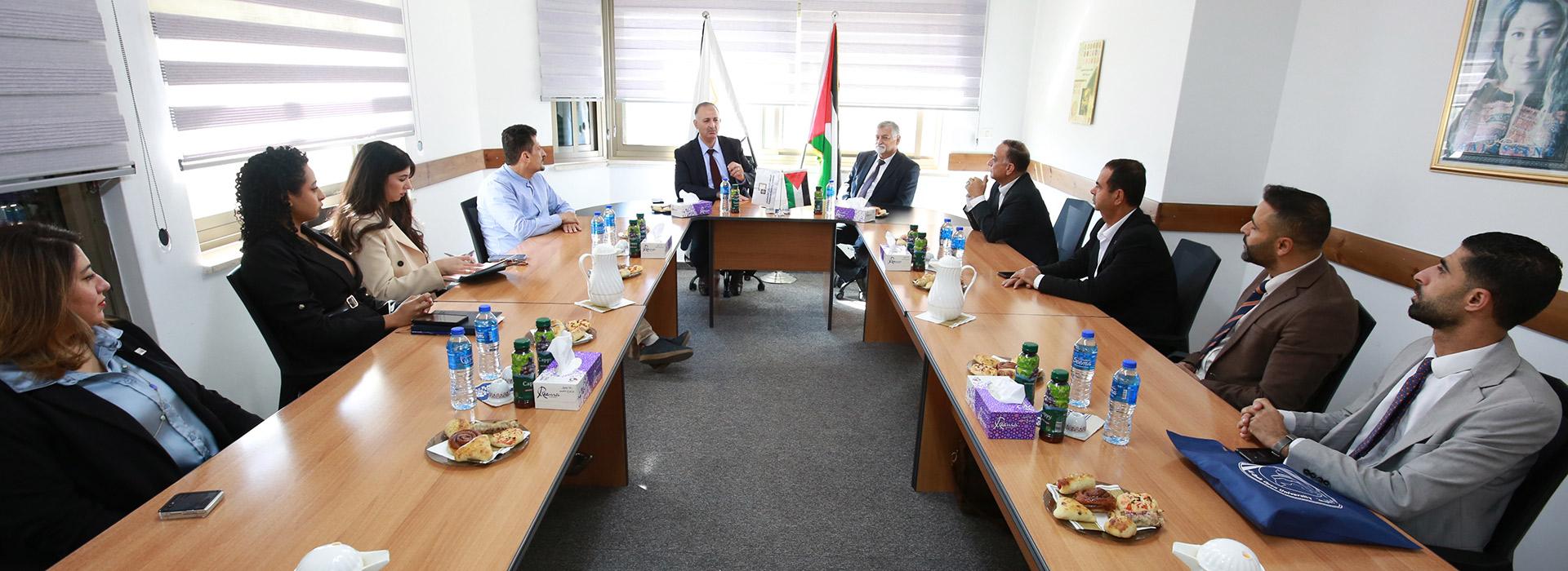 Prof. Samir Najdi and a delegation from Al-Quds Open University visit the Palestinian Banking Institute.